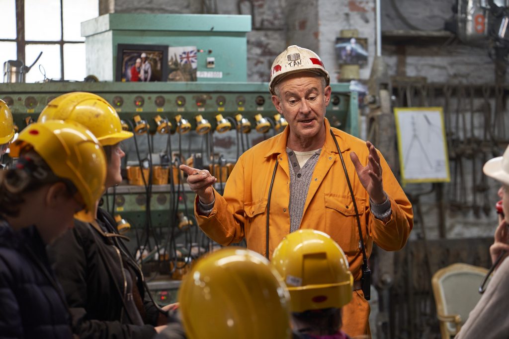 A miner talks through safety procedures before they go underground