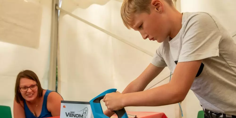 Boy Sawing Wood