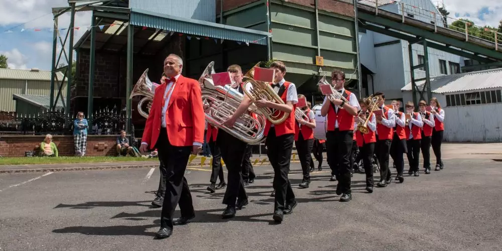 Brass Band marching outside the Screens Buildings