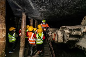 Miner talks about a piece of equipment underground