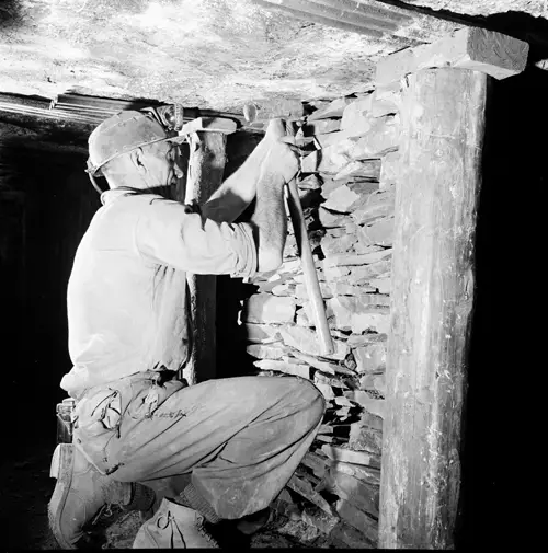 Image of Miner Packing a Roof Image of Miner Packing a Roof