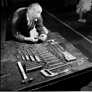 Image of a Miner and a Table of Tools