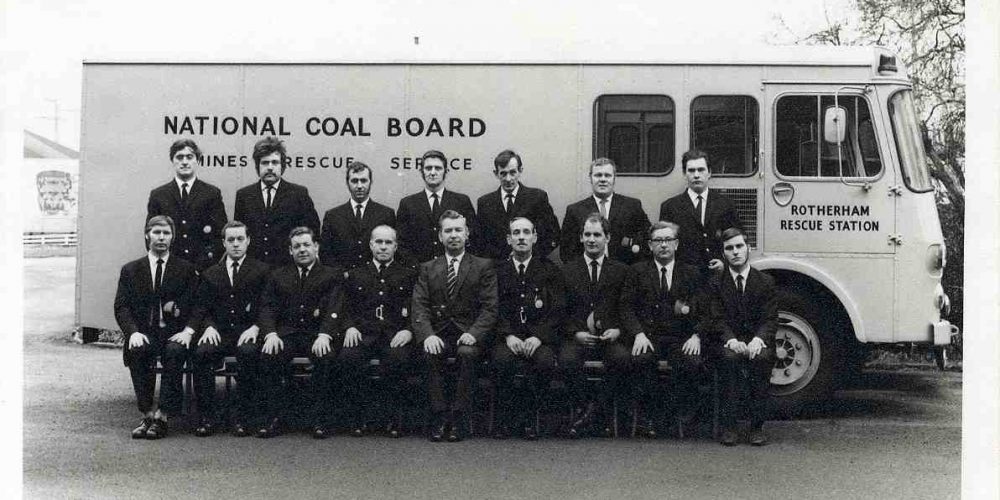 Brigadesmen from Rotherham Mines Rescue Station stood in fornt of a rescue van.