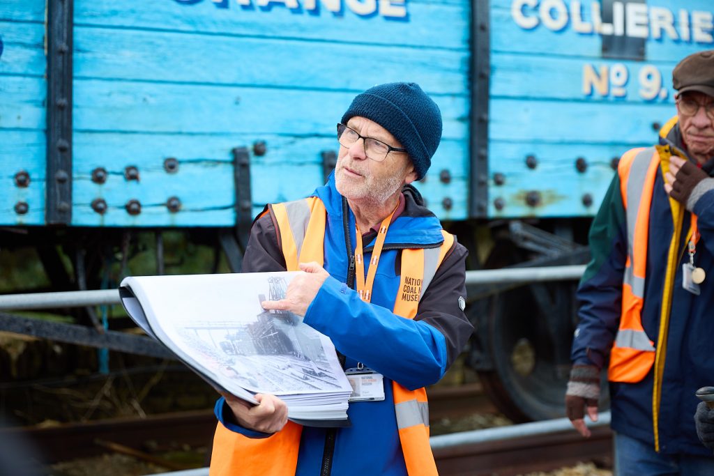 person with a map turning pages