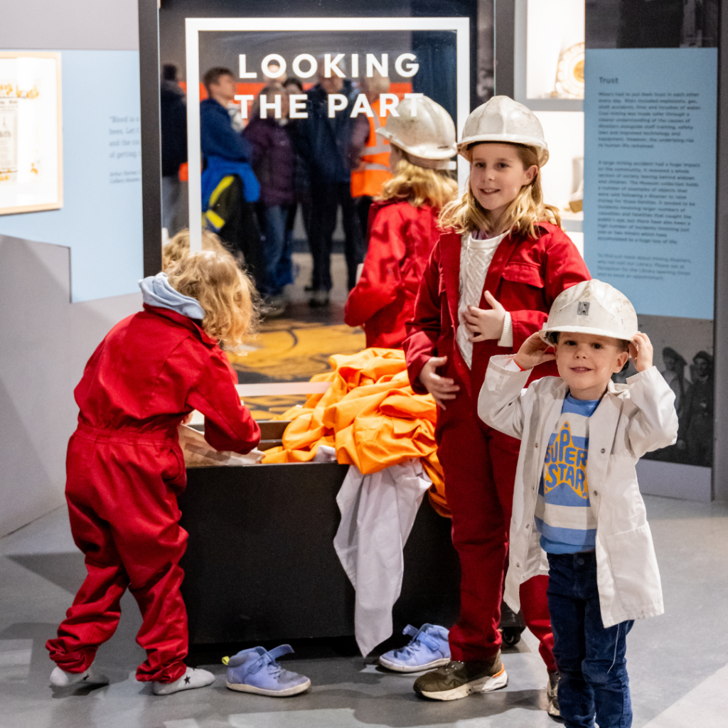 Children dressing up in the gallery