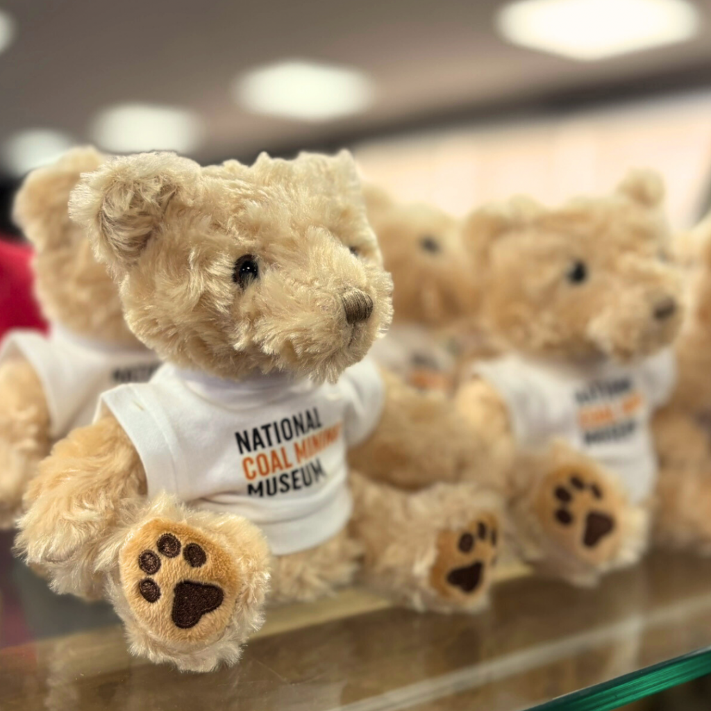 Teddy bears wearing National Coal Mining Museum t-shirts