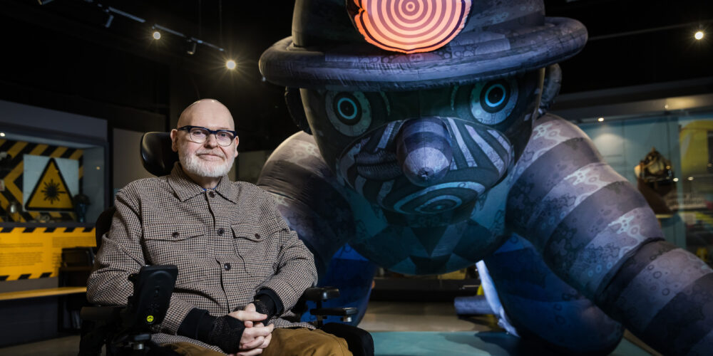Jason in front of a glowing miner inflatable