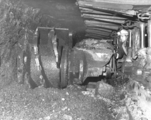 shearer cutting into a rock