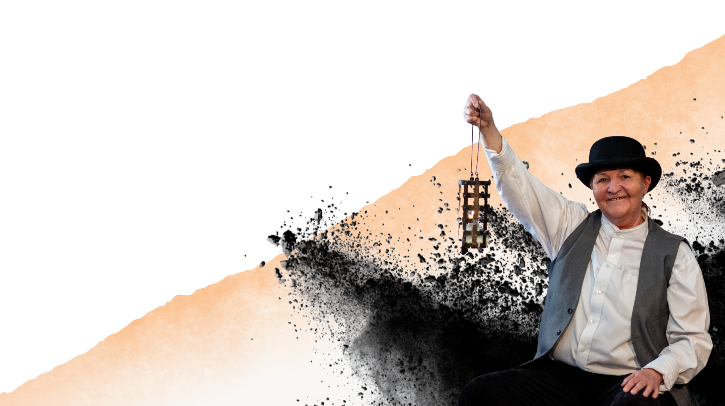 a living history character holding a lamp